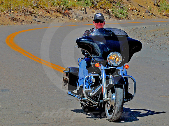 BIKER ON CURVE (Rt 66 Oatman AZ)