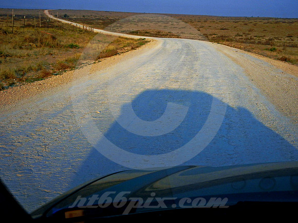 DIRT 66 AT DAWN THROUGH WINDSHIELD (Rt 66 nr Endee NM)