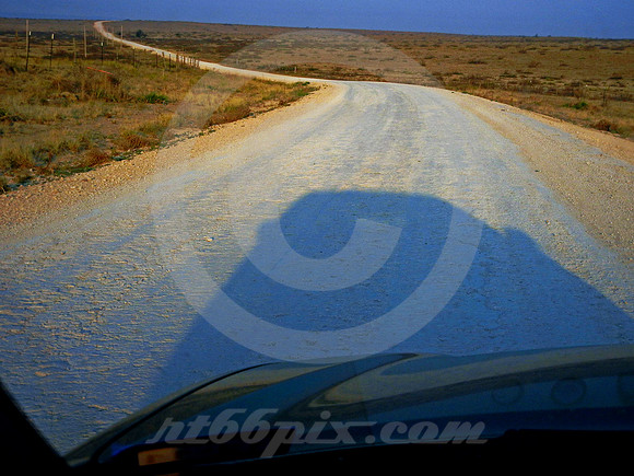 DIRT 66 AT DAWN THROUGH WINDSHIELD (Rt 66 nr Endee NM)