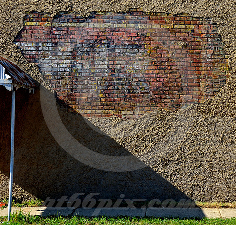 SIGN, STUCCO, SHADOW & SIDEWALK (Rt 66 Galena KS)