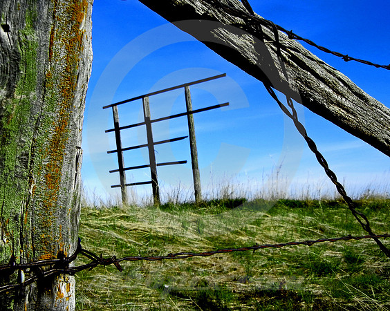 PARTIAL SIGN THROUGH BARBED WIRE FENCE (nr Wall SD)