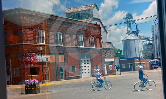 BICYCLISTS IN REFLECTION (Lincoln Highway State Center IA)