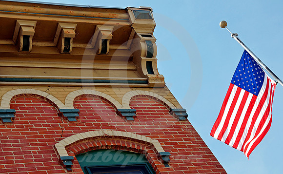 RESTORED BUILDING AND FLAG (Lincoln Highway Fulton IL)